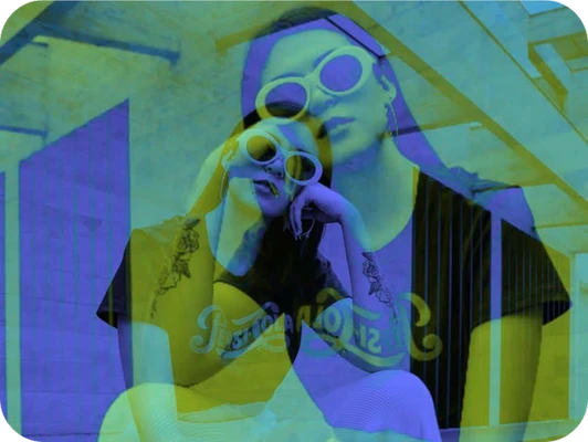 girl with tattoos and glasses with double exposure effect