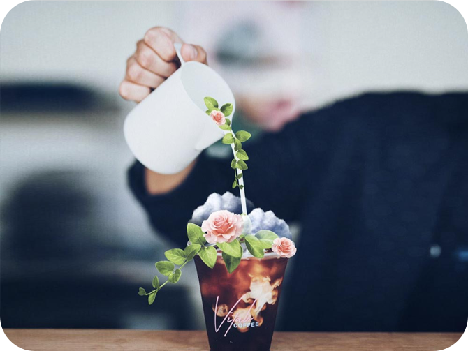 girl pouring water on the cup with rose stickers