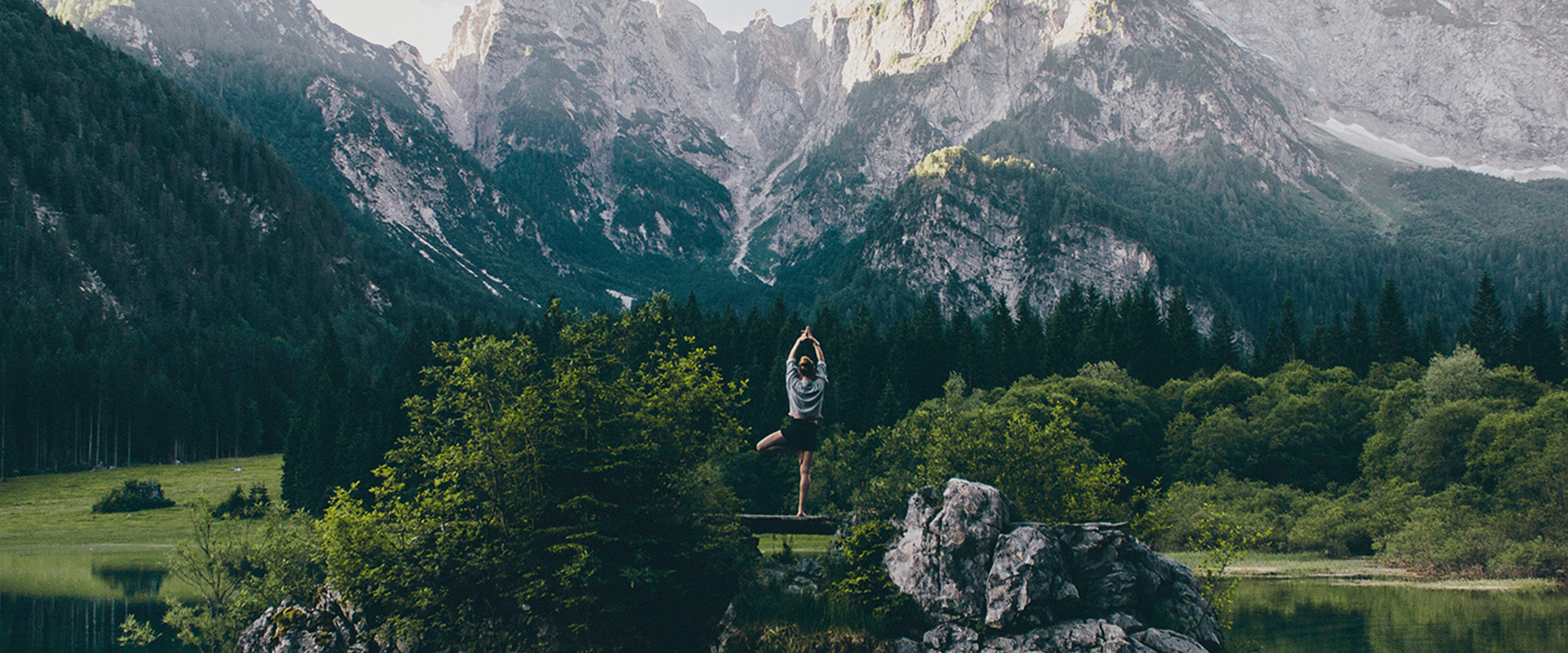 young woman practicing yoga in the nature